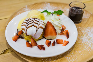 Pancakes with Strawberry and Vanilla Ice cream with chocolate topping