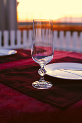 Clean cutlery on the serving table at sunset before dinner