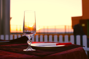 Clean cutlery on the serving table at sunset before dinner