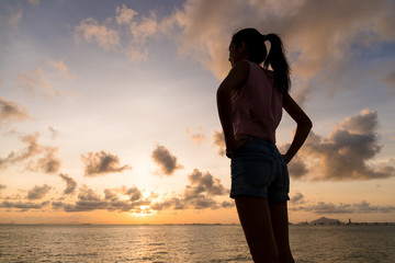 Fototapeta premium Woman looking into the sky thinking