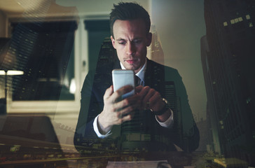 The accountant browsing phone at the workplace