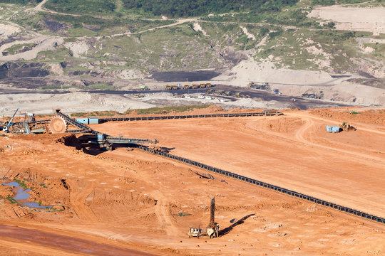 Part of a pit with big mining truck working