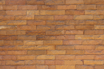 Red texture stonewall background, dotted brown stone partition, old rock wall banner, tan brick home surface, rough grunge brickwall home exterior, stonework grit material sand bar.