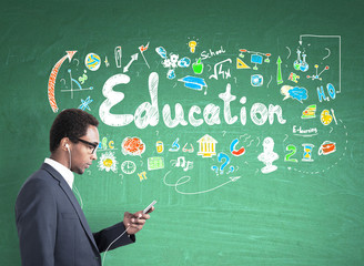 African American man in headphones, education