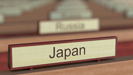 Japan name sign among different countries plaques at international organization. 3D rendering