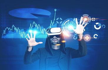Man in VR glasses, graphs and HUD