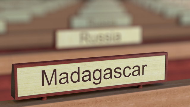 Madagascar name sign among different countries plaques at international organization. 3D rendering