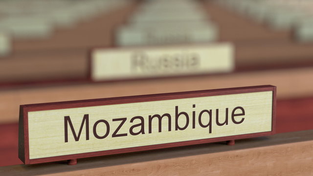 Mozambique name sign among different countries plaques at international organization. 3D rendering