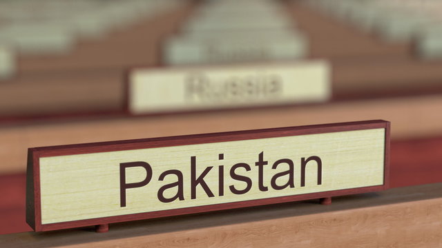 Pakistan name sign among different countries plaques at international organization. 3D rendering