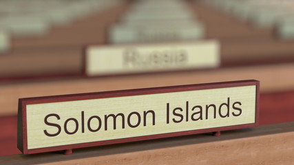 Solomon Islands name sign among different countries plaques at international organization. 3D rendering