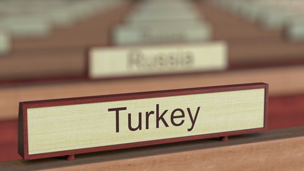 Turkey name sign among different countries plaques at international organization. 3D rendering