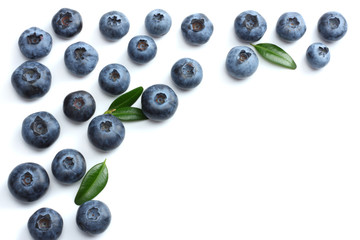 blueberries with green leaf isolated on white background
