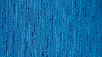 Blue texture with rough surface. Vertical furrow goes upside down.