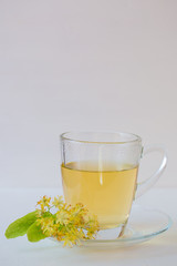 Linden tea in glass mug.
