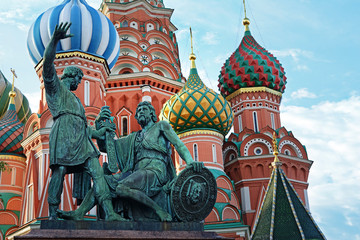 Fototapeta na wymiar The monument to Minin and Pozharsky and Saint Basil's Cathedral in Moscow, Russia