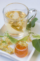 Linden tea in glass mug.