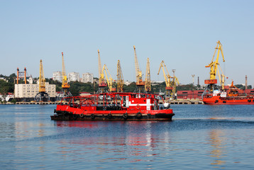 seaport with cranes and cargo ships