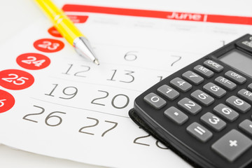 Calendar Days With Calculator And Pen Aside On White Background