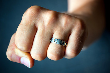 Rosary ring and fist - Powered by Adobe