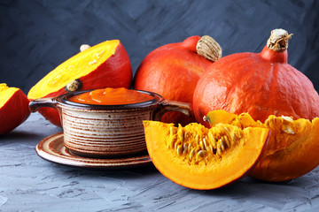 Pumpkin soup with fresh autumn hokkaido pumpkins - obrazy, fototapety, plakaty
