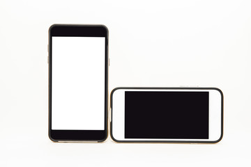 Two mobile phones cellphones with blank screens vertically and horizontally isolated on white background