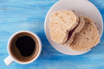 Black coffee and sweet sandwiches