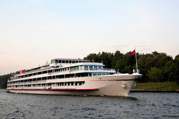 Fototapeta premium A cruise liner is sailing along the river.