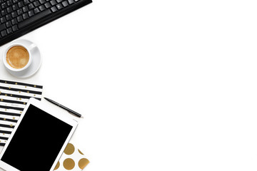 Flat lay photo of office white desk with tablet, keyboard and gold notebook copy space background