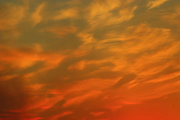 sunset with reddish yellow clouds