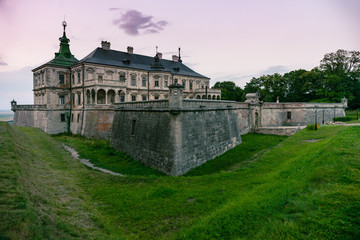 Fototapeta na wymiar Medieval Pidhirtsi Castleat the evening, Pidhirtsi village, Lviv region, Ukraine