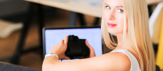 Young photographer and graphic designer at work