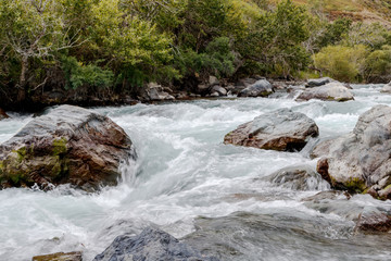 Fototapeta premium in summer rocky mountain river water silk. mountain river