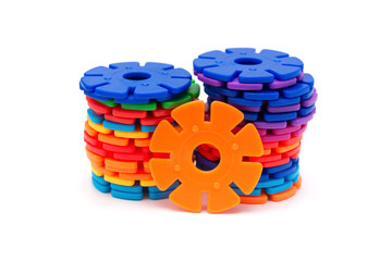 colorful plastic snowflake toy on white background