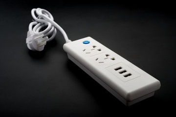 side view multi sockets power extension with switch and USB chargers on black