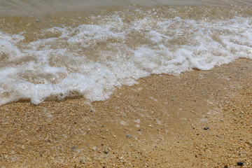 Wave foam at beach
