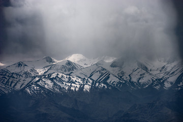 Moutain range covered by dark cloud