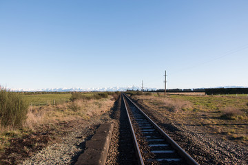 Fototapeta premium Railway and Southern Alps