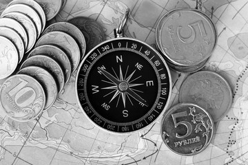 Fototapeta na wymiar Compass and money on the map,a set of traveler