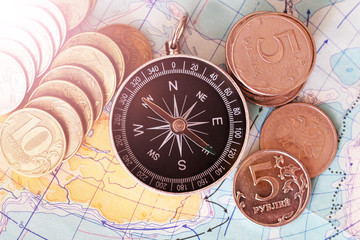 Fototapeta na wymiar Compass and money on the map,a set of traveler