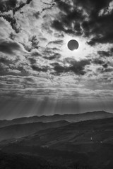 Scientific natural phenomenon. Total solar eclipse with diamond ring effect glowing on sky.