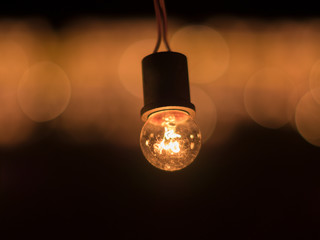 Illuminated light bulb at night, business idea concept
