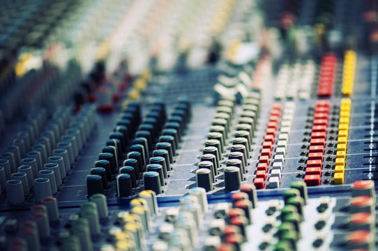 Closeup of colorful audio mixer.