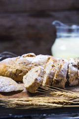 Freshly baked traditional bread on wooden table Oatmeal Bread