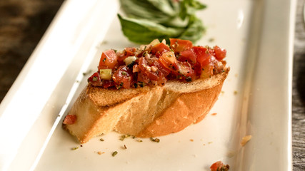 bruschetta appetizer at Italian restaurant. tomatoes refresh food