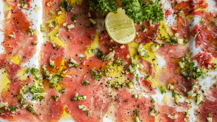 Raw slice beef carpaccio plate, tasty Italian cuisine