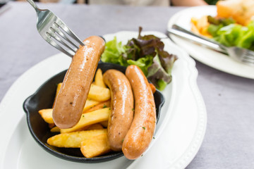 the delicious sausage with french fries