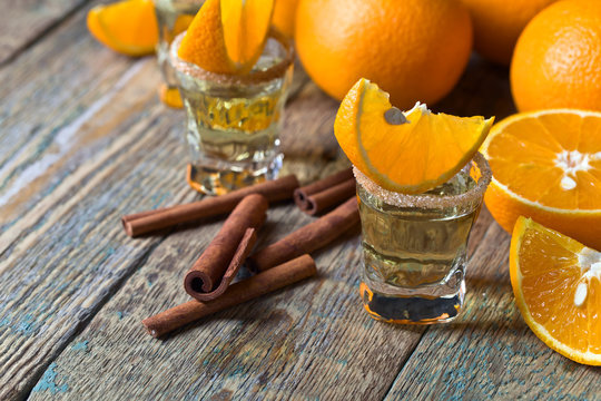 Gold tequila with orange and cinnamon .