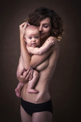 Young mother holding a baby in her arms