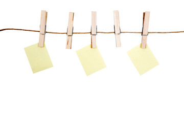 blank memo papers on rope with Clothespins, on white backgrounds, isolated.