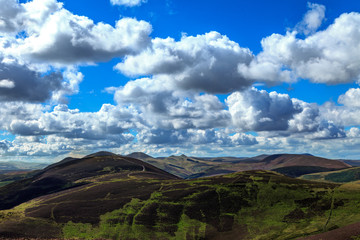 view across the Pentland Hills Scotland with a bright sky